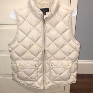 Bleached sand color excursion quilted down vest.